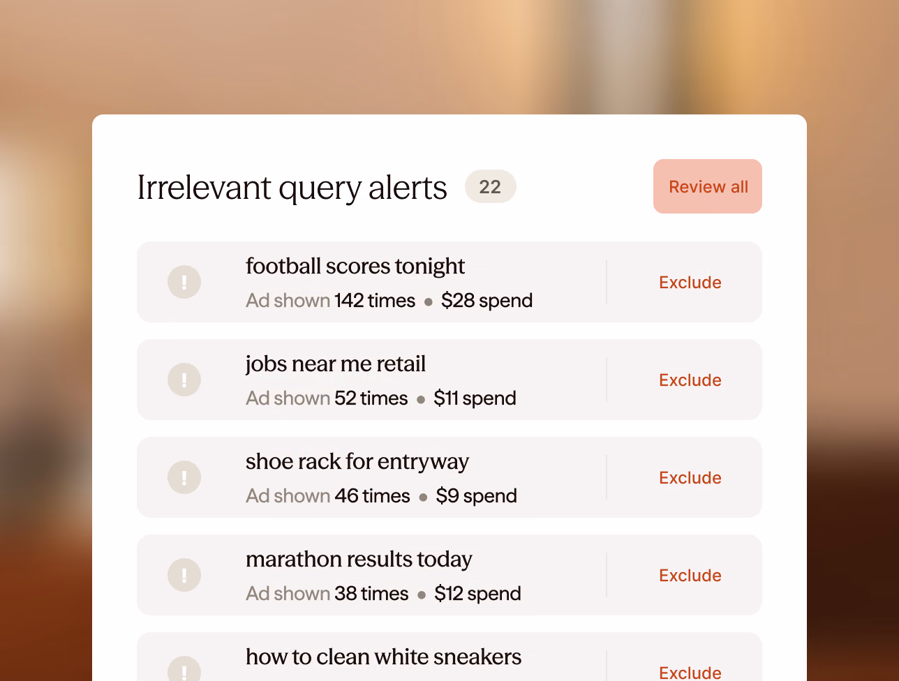 An “Irrelevant query alerts” card with 22 alerts — football scores tonight, jobs near me retail, shoe rack for entryway, marathon results today — each with how often the ad showed, what it cost, and an Exclude button.
